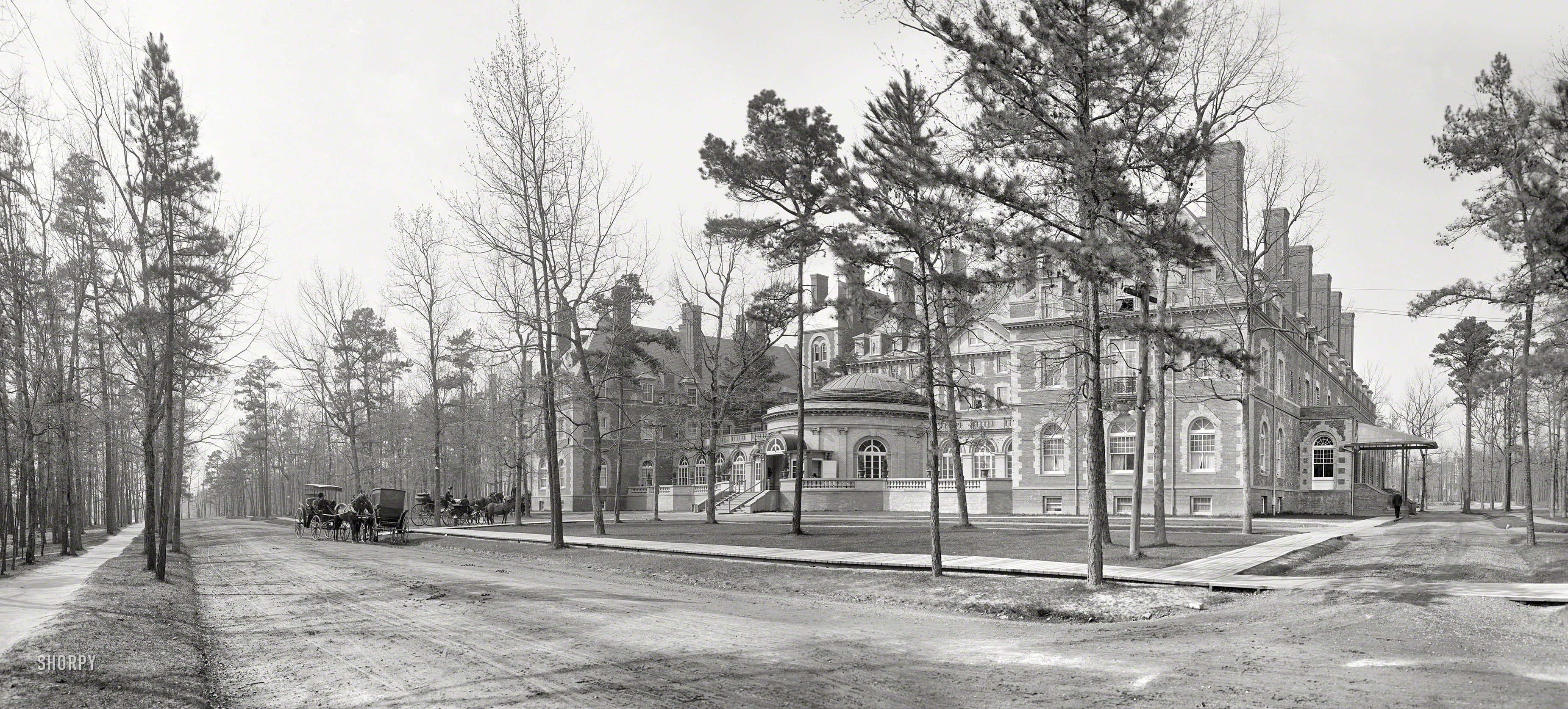 Lakewood, New Jersey, circa 1901. "Laurel in the Pines." This winter resort hotel on Lake Carasaljo, which opened in 1891, was leveled by fire in 1967. Composite of two 8x10 inch glass negatives by William Henry Jackson. View full size.