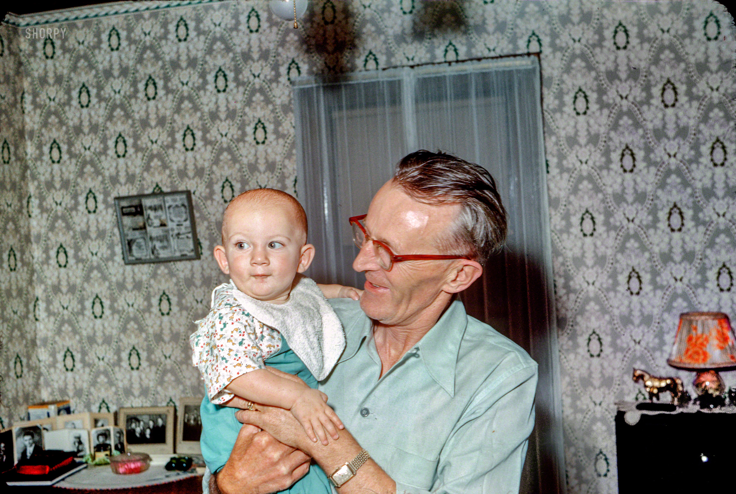 August 10, 1952. "Art Frandle and Steven Lee (10 months)." The latest dispatch from Blue Earth, Minnesota. Kodachrome by Hubert Tuttle. View full size.