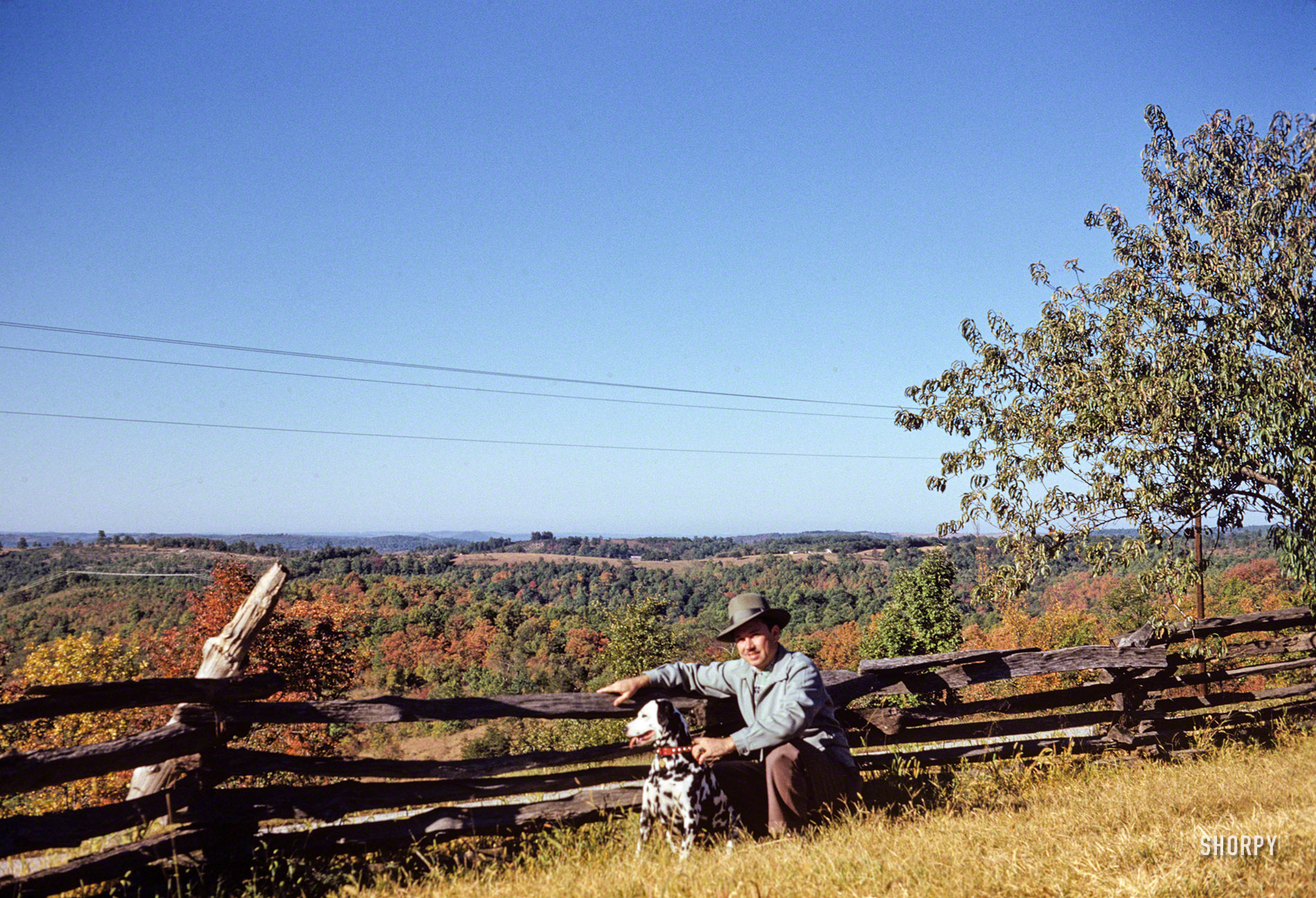 "7 October 1952 -- At Old Matt's Cabin." Hubert and Sally at the Shepherd of the Hills homestead, a farm in the Ozarks made famous by Harold Bell Wright's 1907 book, and the start of Branson, Missouri's transformation into a tourist destination. Kodachrome slide by Grace Tuttle. View full size.