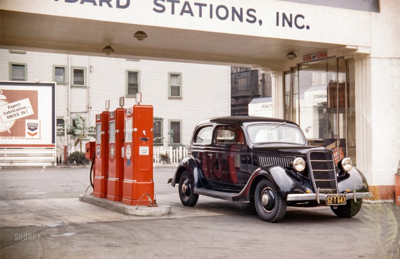 "1935 Ford Tudor sedan at gas station." The year is 1941, and we are somewhere in Southern California. Kodachrome by our West Coast "carrespondent" Don Cox. View full size.
