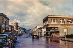 "Astoria '44" is the latest Kodachrome from Navy photographer's mate Don Cox. The view here is looking west along Commercial Street at the intersection with 14th. View full size.