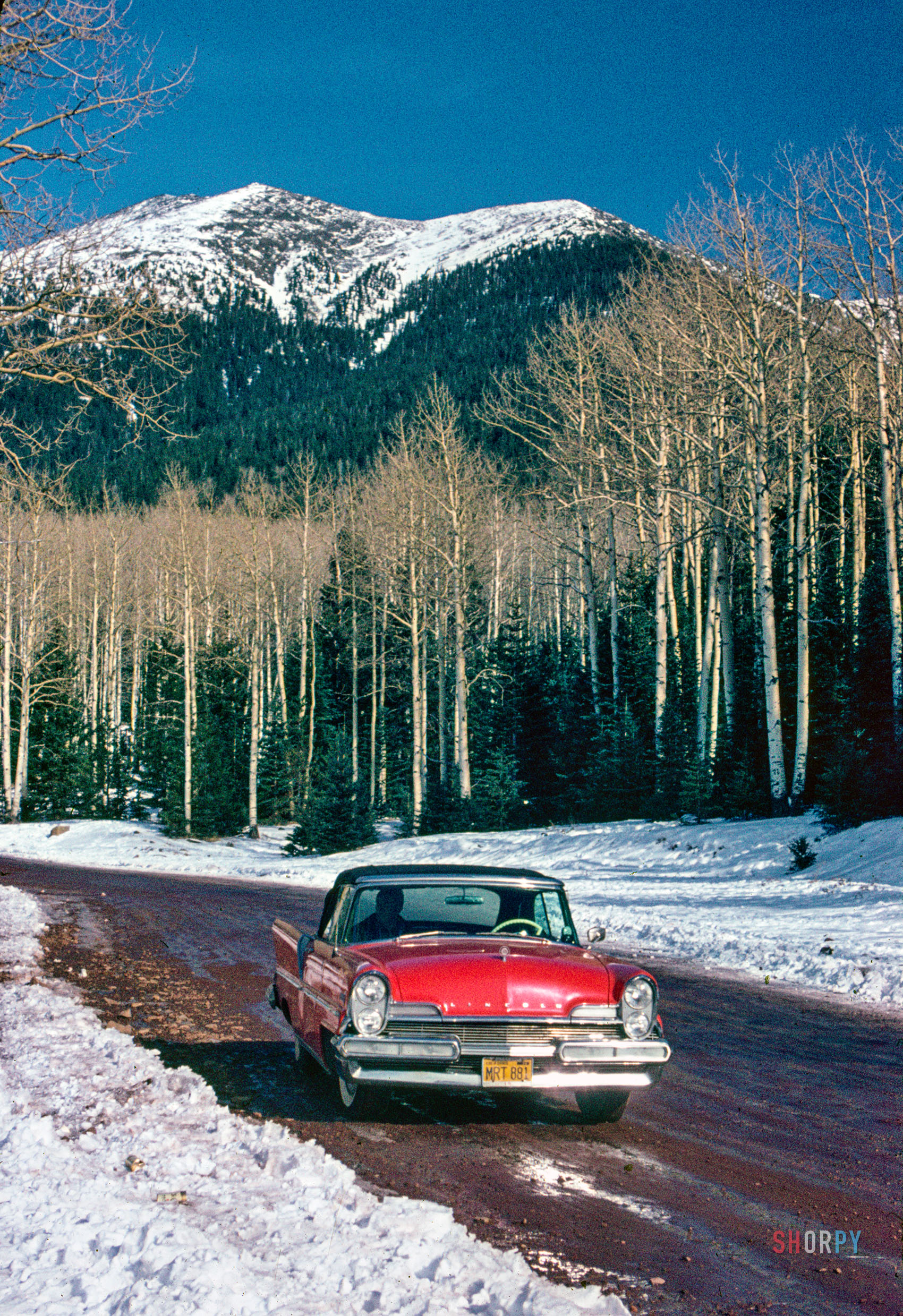 January 1963. "Lincoln convertible on snow road." From somewhere in the Sierras comes this Agfachrome of Don Cox's red 1957 Lincoln Premiere against a backdrop of snow white and sky blue. Happy Fourth of July from Shorpy! View full size.