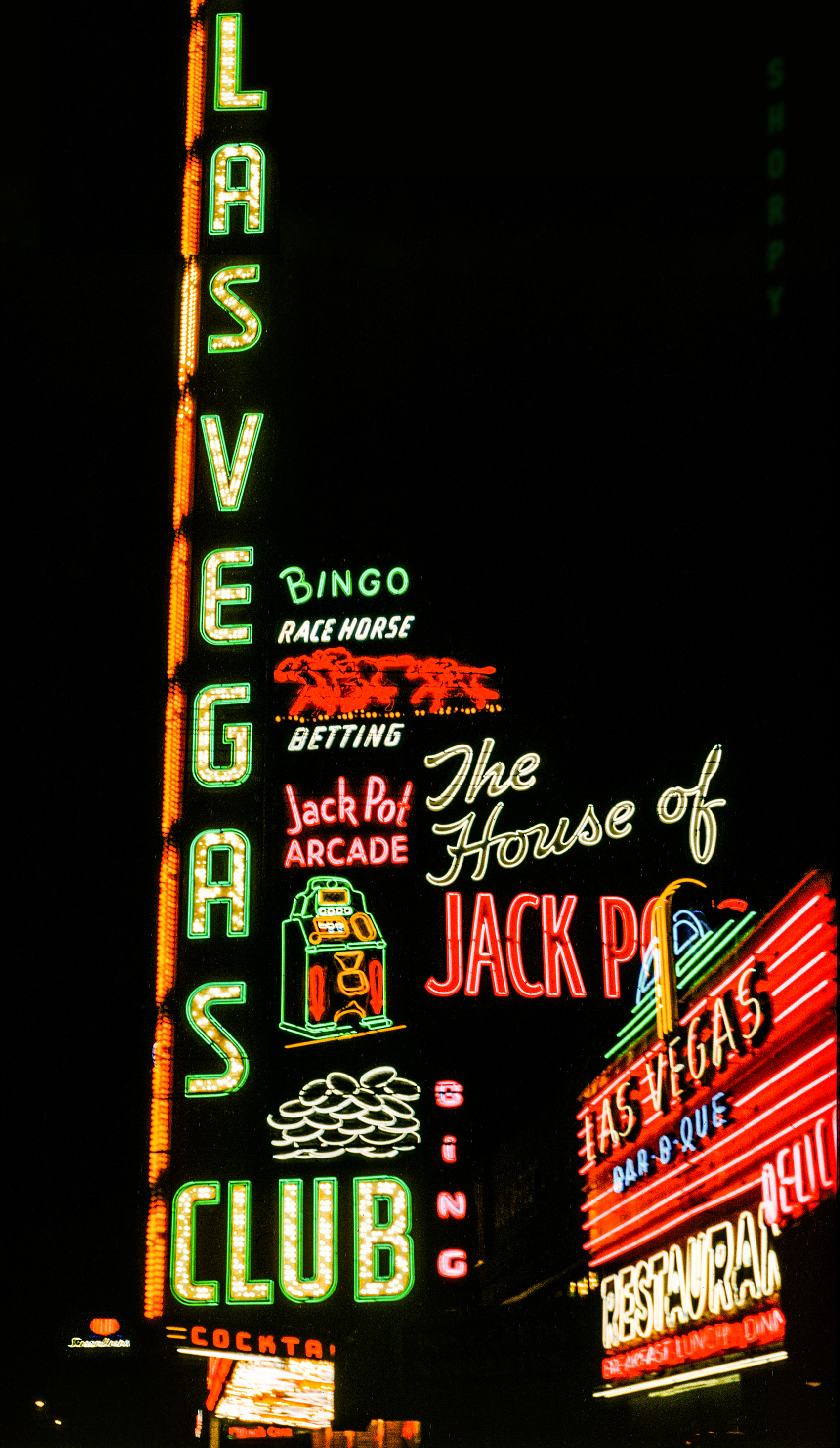 From 1951 and Don Cox comes our second nighttime glimpse of the Las Vegas Club, "The House of Jack Pots." 35mm Kodachrome transparency. View full size.
