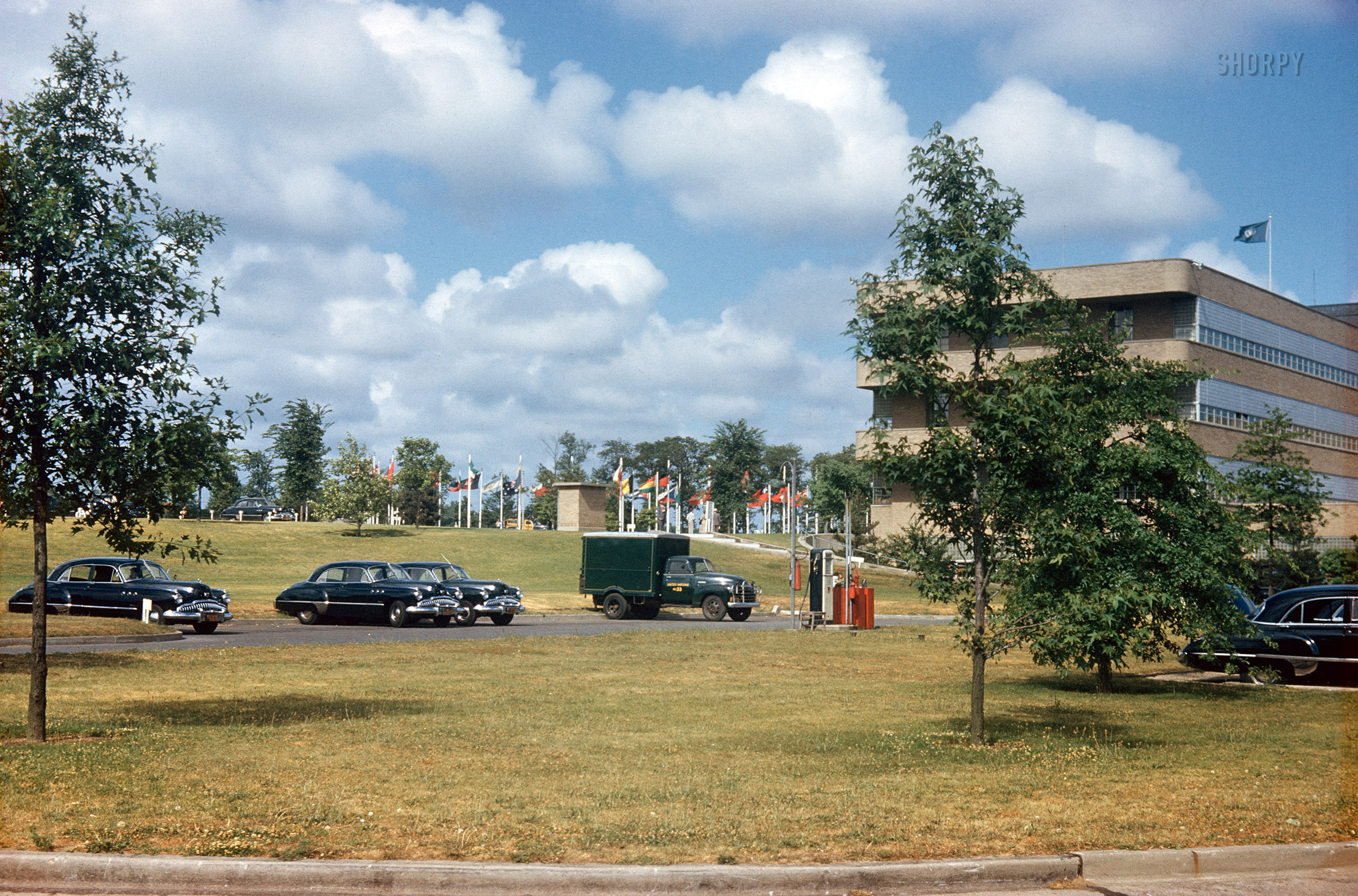 Circa 1949. "United Nations, Lake Success, New York." The organization's temporary headquarters at the Sperry Gyroscope industrial park on Long Island, along with its fleet of black Buick Super sedans. 35mm Kodachrome transparency. View full size.