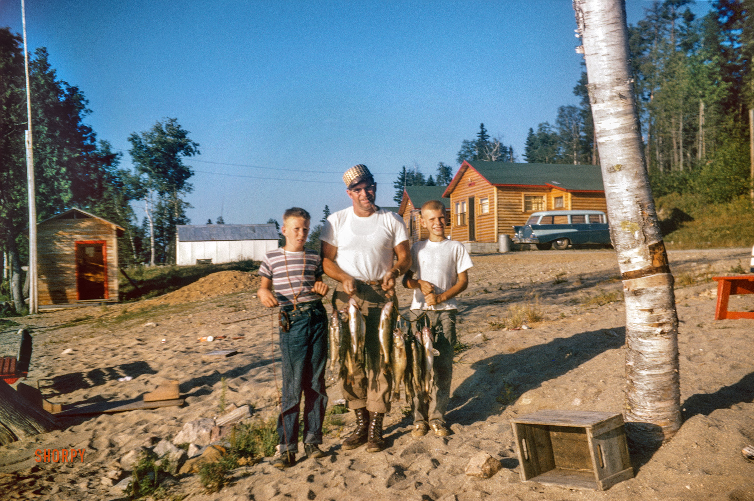 The North Woods circa 1958. "Jim Baker and Mike." 35mm Kodachrome. View full size.
