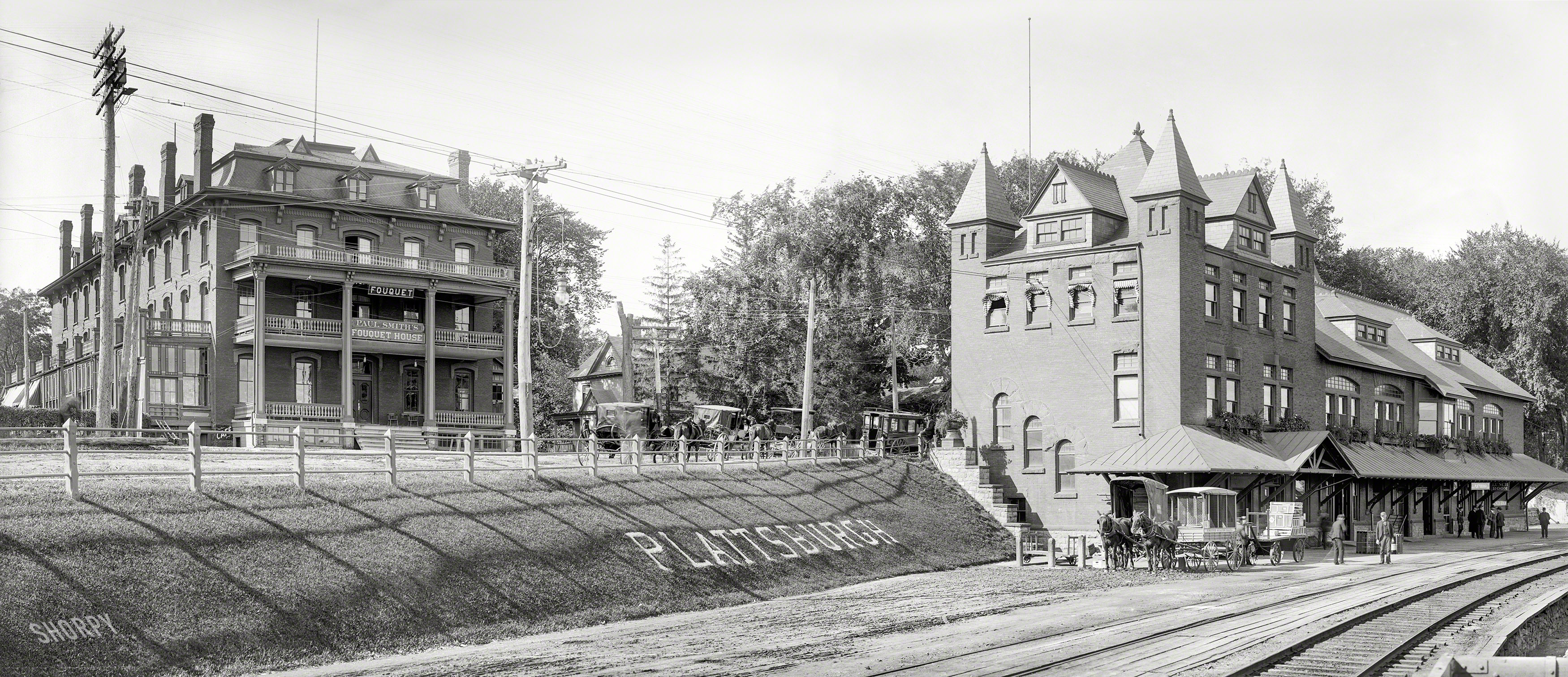 1904. "Fouquet House and Delaware & Hudson R.R. station, Plattsburgh, N.Y." Panorama made from two 8x10 inch glass negatives. View full size.