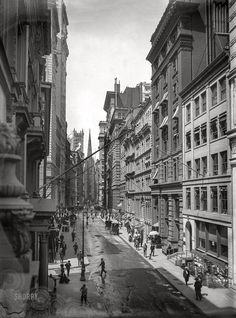 New York circa 1910. "View down Wall Street to Trinity Church." Its steeple sharing the Lower Manhattan skyline with the obelisk-topped "Chimney Building" at 1 Wall Street. 6x8 inch dry plate glass negative by Robert L. Bracklow. View full size.
