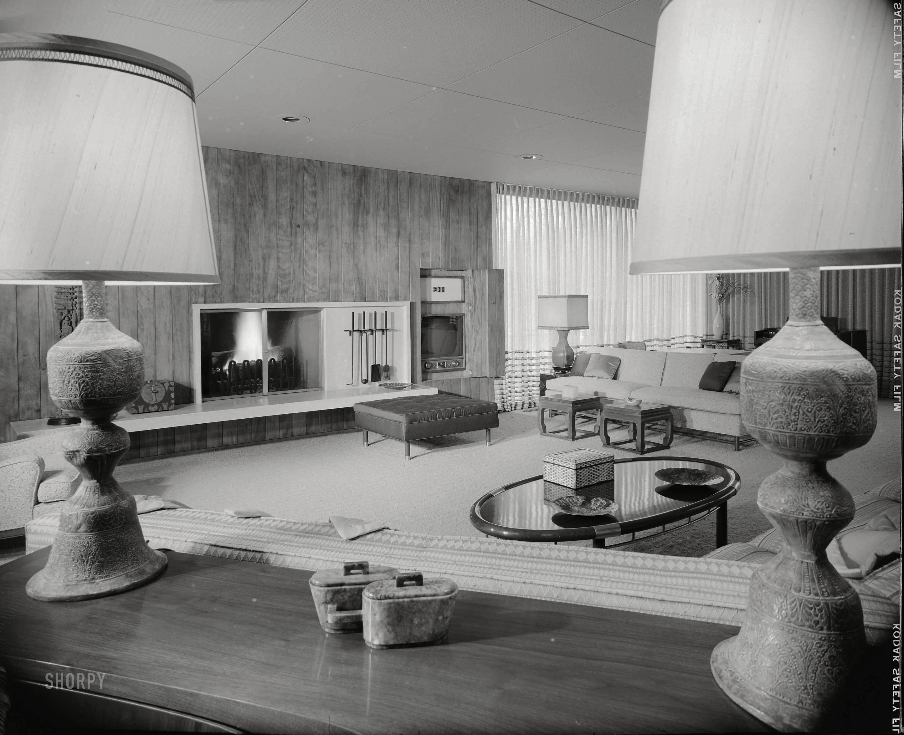 1956. "Hayes residence, Kessler Lake Drive, Dallas. Living room to fireplace. Architects: Prinz & Brooks." Our second look at Chevrolet dealer Earl Hayes' midcentury manse with the tacky acoustic-tile ceiling. Photo by Maynard L. Parker for House Beautiful. Source: Huntington Library. View full size.