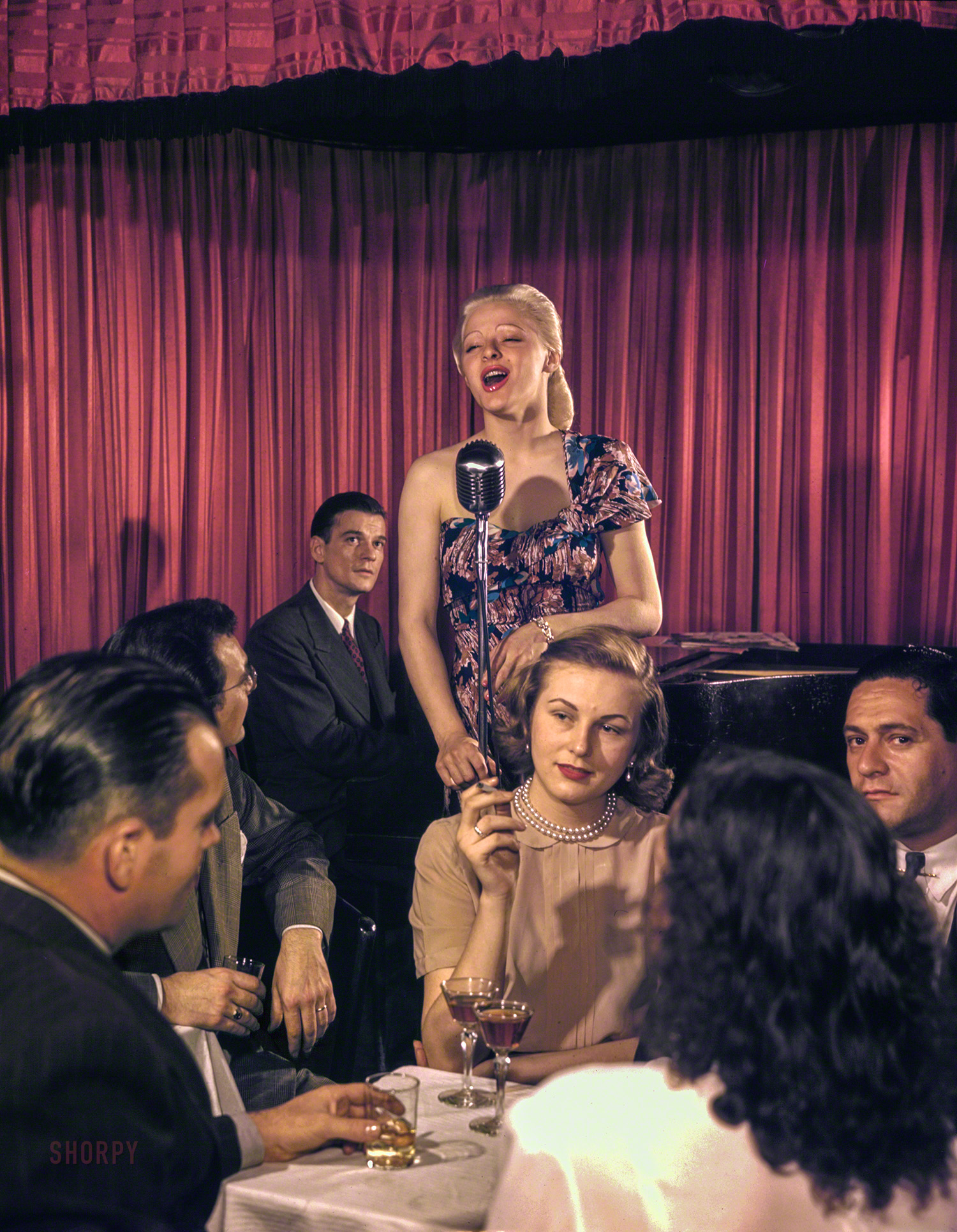 New York circa 1948. "Jazz singer at the Onyx Club, 52nd Street." We trust that this canary won't stay unidentified for long. Medium format Kodachrome transparency by Down Beat photographer William Gottlieb. View full size.