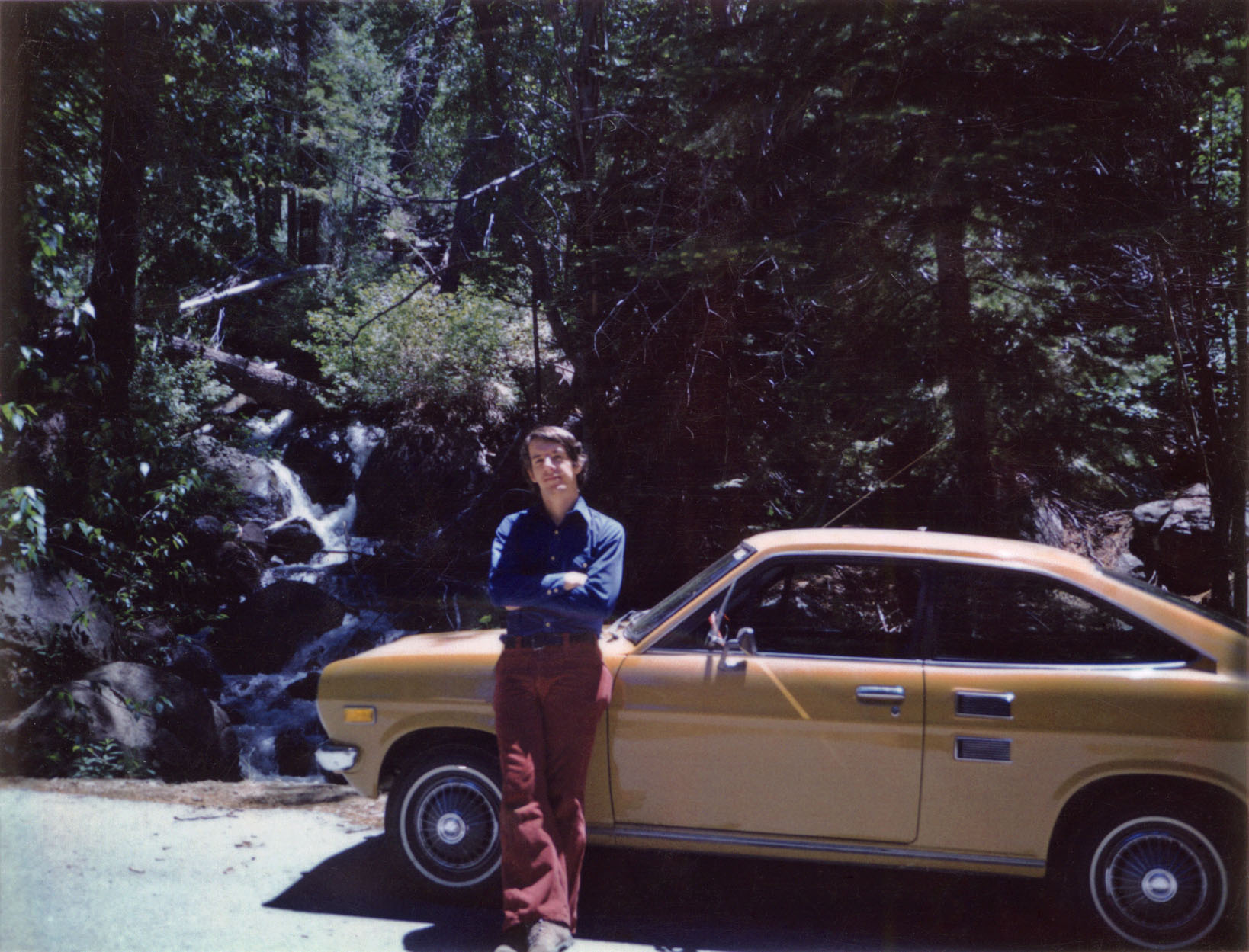 Summer 1972, Lake Tahoe. You'd think, after hearing me rhapsodize about my lifelong obsession with cars, that a) I'd have learned to drive before I was 26, and b) my first car would have been something a bit more spectacular than a 1972 Datsun 1200. That's Nissan to you. Well, I had nice pants, anyway. Not bad for a Polaroid, though scuffed as usual. View full size.