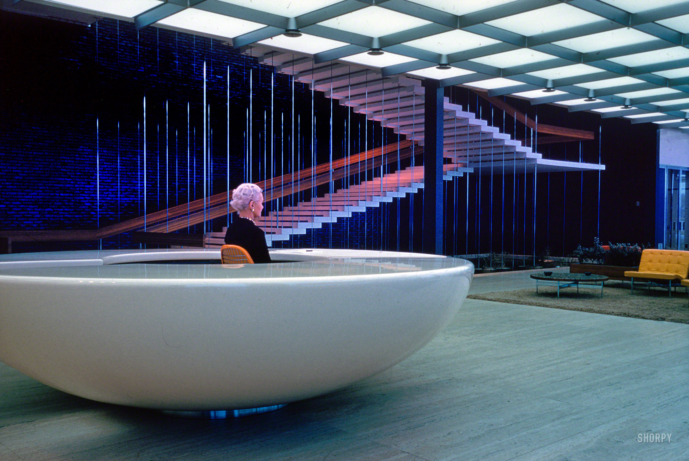 1956. "General Motors Technical Center, Warren, Michigan. Design Center interior with stair in background. Eero Saarinen, architect." Our second look at the reception disk and its pilot. Kodachrome by Balthazar Korab. View full size.