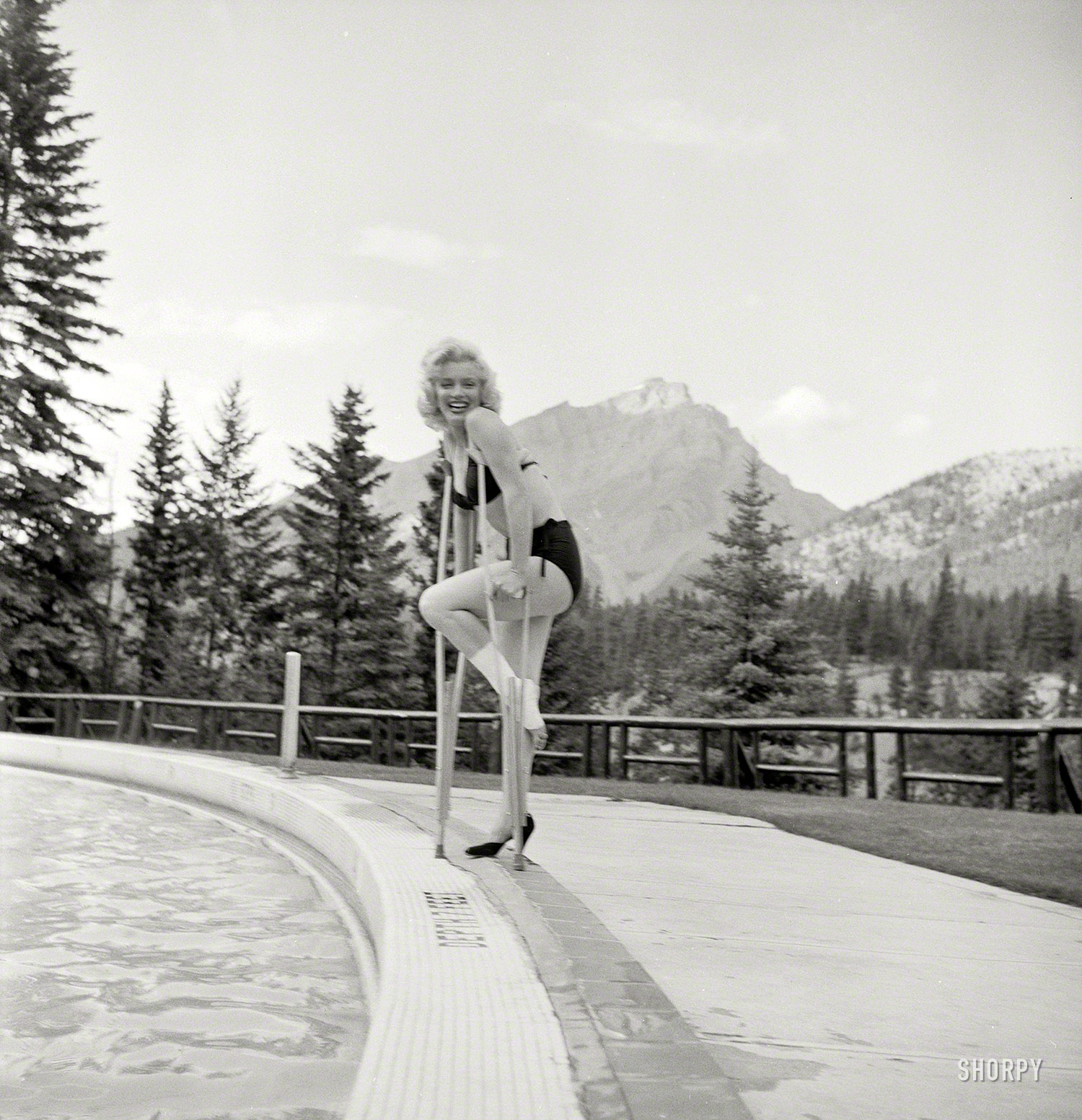 Marilyn Monroe in 1953 at the Banff Springs Hotel in Alberta, among those other majestic peaks known as the Canadian Rockies. She sprained her ankle filming River of No Return. Photo by John Vachon for Look magazine. View full size.