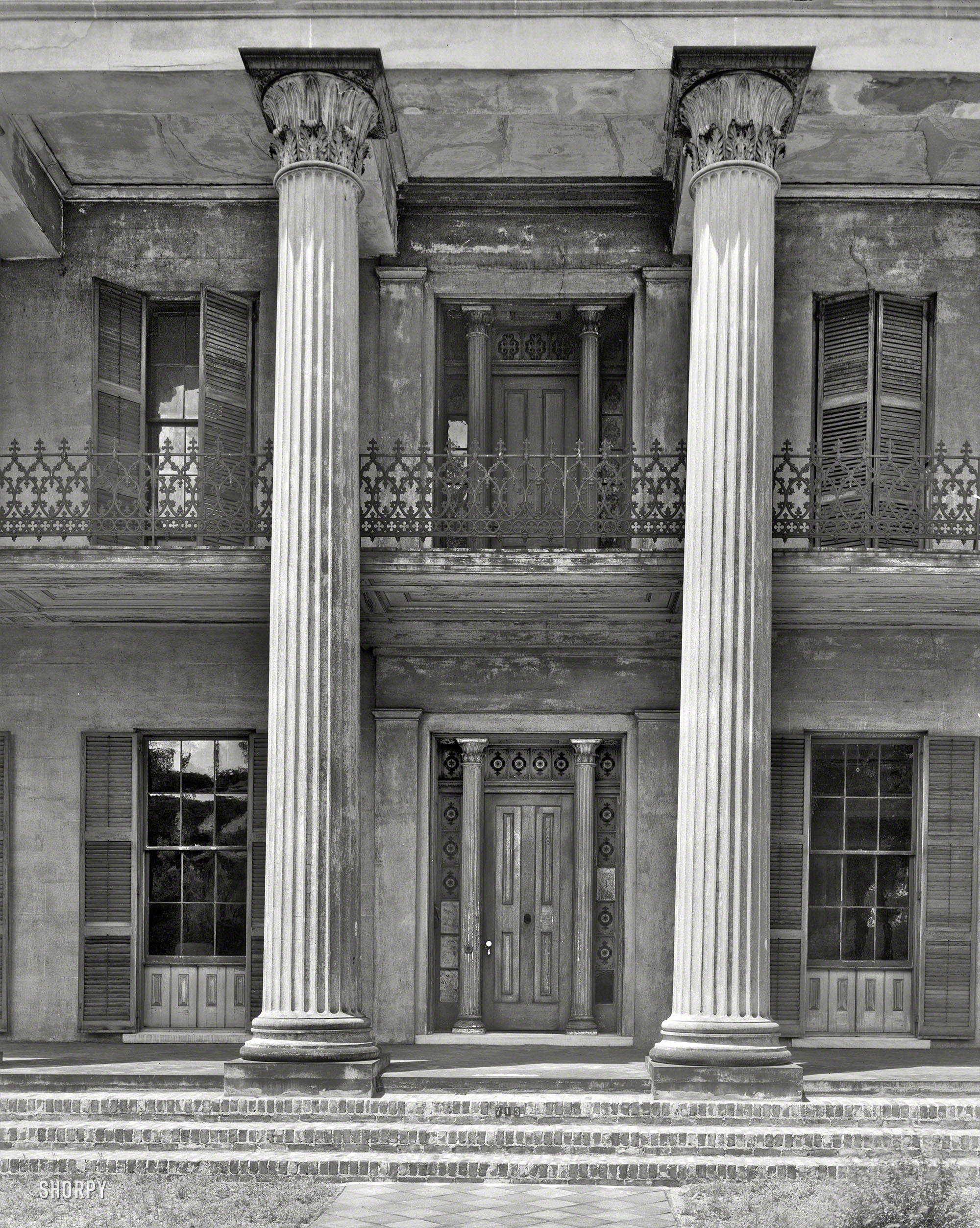 1939. "Watts-Parkman-Gillman House, 713 Mabry Street, Selma, Dallas County, Alabama. Two-story masonry construction dates to 1852. Greek Revival stone columns across front. Fine ironwork on second-story balcony." 8x10 inch acetate negative by Frances Benjamin Johnston. View full size.