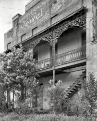 1939. "St. James Hotel, Selma, Dallas County, Alabama. Building dates to circa 1840. Now market warehouse. Three story brick masonry, two story porch, ornamental iron work." Photo by Frances Benjamin Johnston. View full size.
