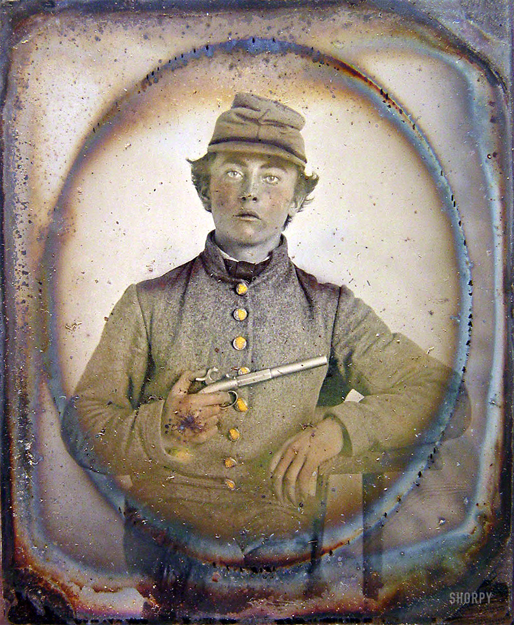 Ca. 1861-65. "Young soldier in Confederate shell jacket and forage cap with single shot pistol." Sixth-plate ambrotype, hand-colored. Liljenquist Family Collection of Civil War Photographs, Library of Congress. View full size.