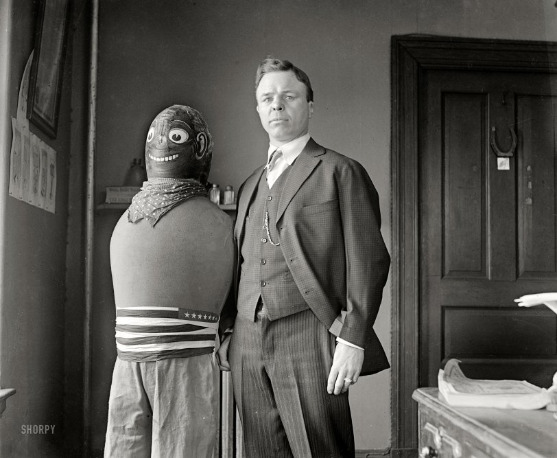 "Battling Nelson." The Danish lightweight champion Oscar "Bat" Nelson circa 1920s and what seems to be a punching-bag effigy of a black opponent. This glass negative, whose neighbors are dated March 1927, was probably used to illustrate contemporaneous newspaper accounts of Bat's arrest for larceny and subsequent placement under psychiatric observation, a convoluted tale related in the comments here. National Photo Company Collection. View full size.
