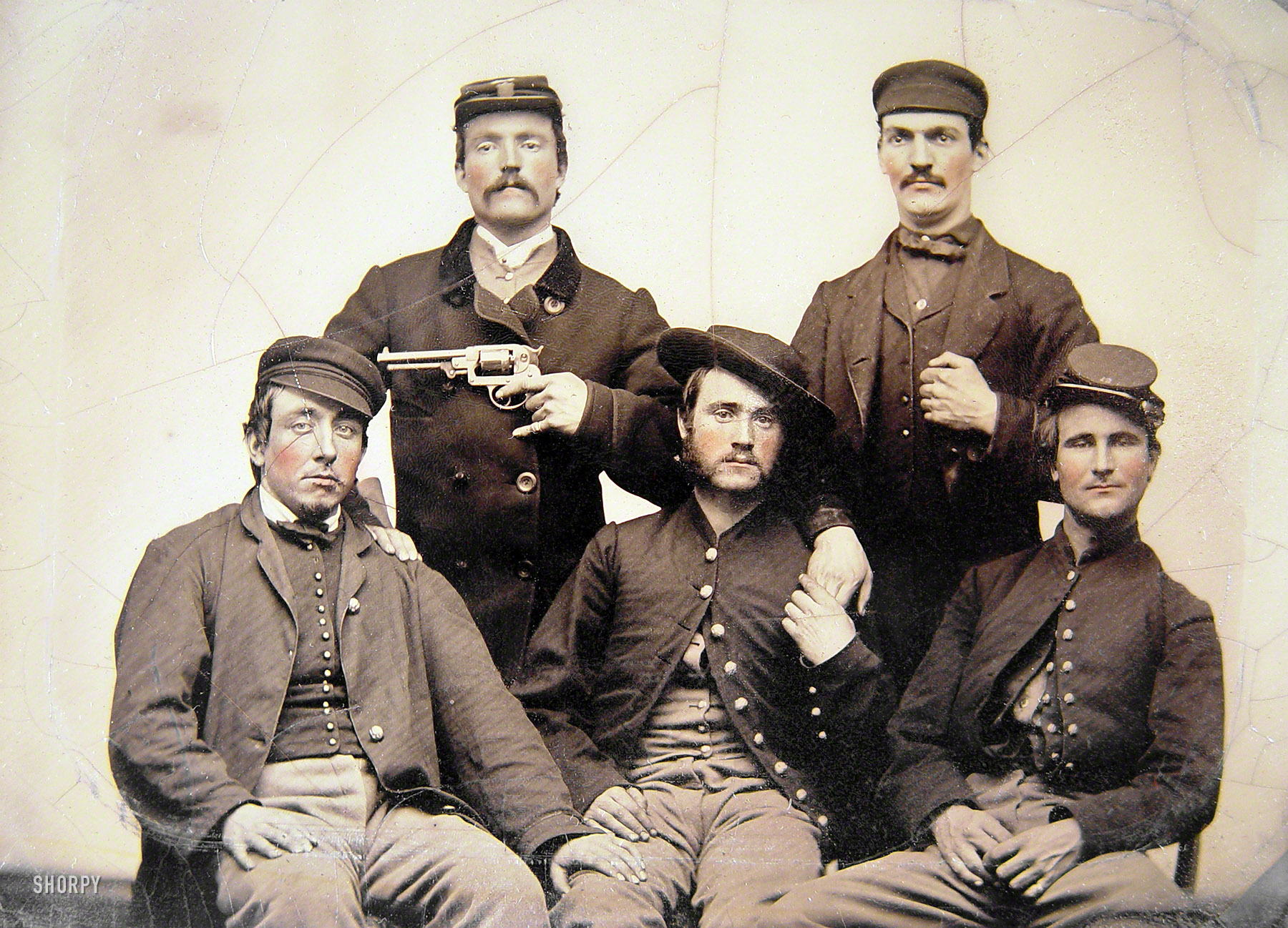 More Civil War cutups. "Unidentified men in Union uniforms, one pointing a revolver at another's head." Half-plate tintype, hand-colored. Liljenquist Family Collection of Civil War Photographs, Library of Congress. View full size.