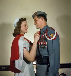 1948. Mooseheart, Illinois. "Activities at Mooseheart orphanage. High school boy and girl in their Cadet Corps uniforms." And their chaperone. Kodachrome by Stanley Kubrick for Look magazine. View full size.