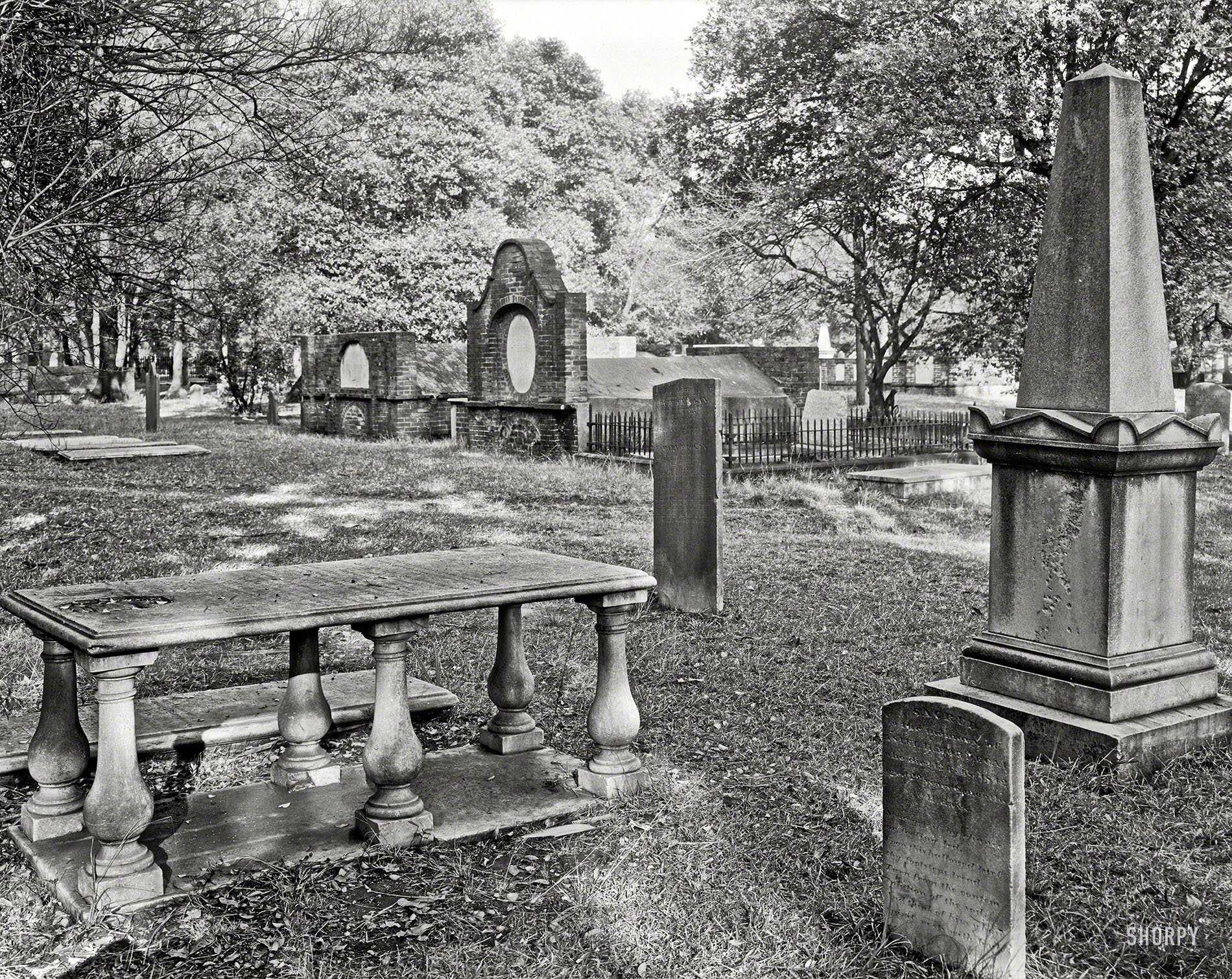 Circa 1939. "Savannah, Chatham County, Georgia. Stone monuments and brick vaults in Colonial Park, formerly South Broad Street Cemetery." 8x10 inch acetate negative by Frances Benjamin Johnston. View full size.