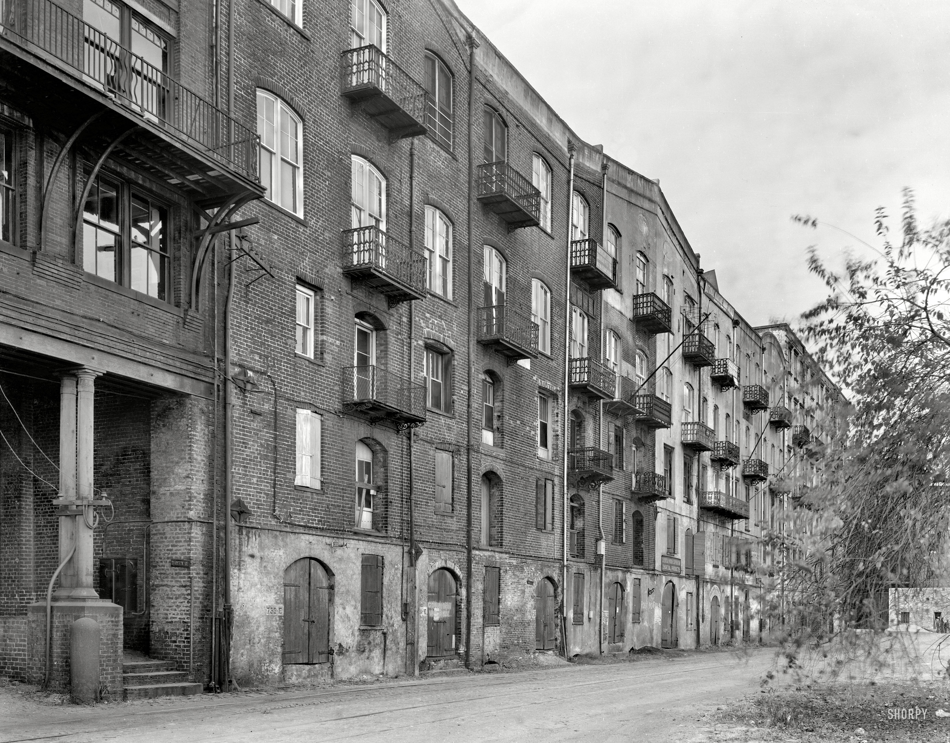 1937. "Stoddard's Lower Range from Factors Walk, River Street, Savannah, Georgia." Cotton warehouses built by John Stoddard on the bluffs above the Savannah River in the late 1850s. This seems ripe for one of those condo conversions where the price features a decimal point. View full size.
