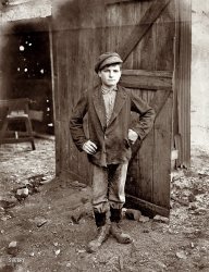 August 1908. "A Glass Works Boy waiting for the Night Shift. Indiana Glass Works." Photograph by Lewis Wickes Hine. View full size.