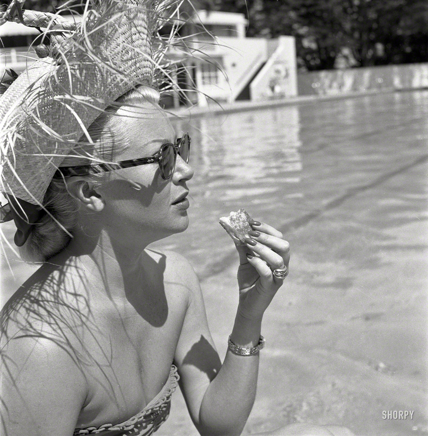 &nbsp; &nbsp; &nbsp; &nbsp; Lana Turner as shot for Look magazine. Which was, basically, an imitation of Life.
June 1951. "Actress Lana Turner lunching poolside at the Coral Casino in Santa Barbara, Calif." From photos by Earl Theisen for Look magazine. View full size.