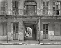 New Orleans, 1937. "Courtyard entrance, 1133-1135 Chartres St." Seen here from another courtyard. Photo by Frances Benjamin Johnston. View full size.