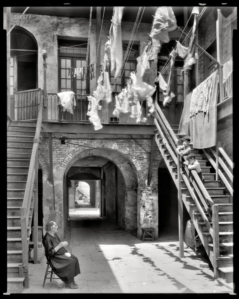 New Orleans circa 1937. "Courtyard at 1133-1135 Chartres Street." Young and old, hangin' with the laundry. The head count here is three, the foot count nine. 8x10 acetate negative by Frances Benjamin Johnston. View full size.
