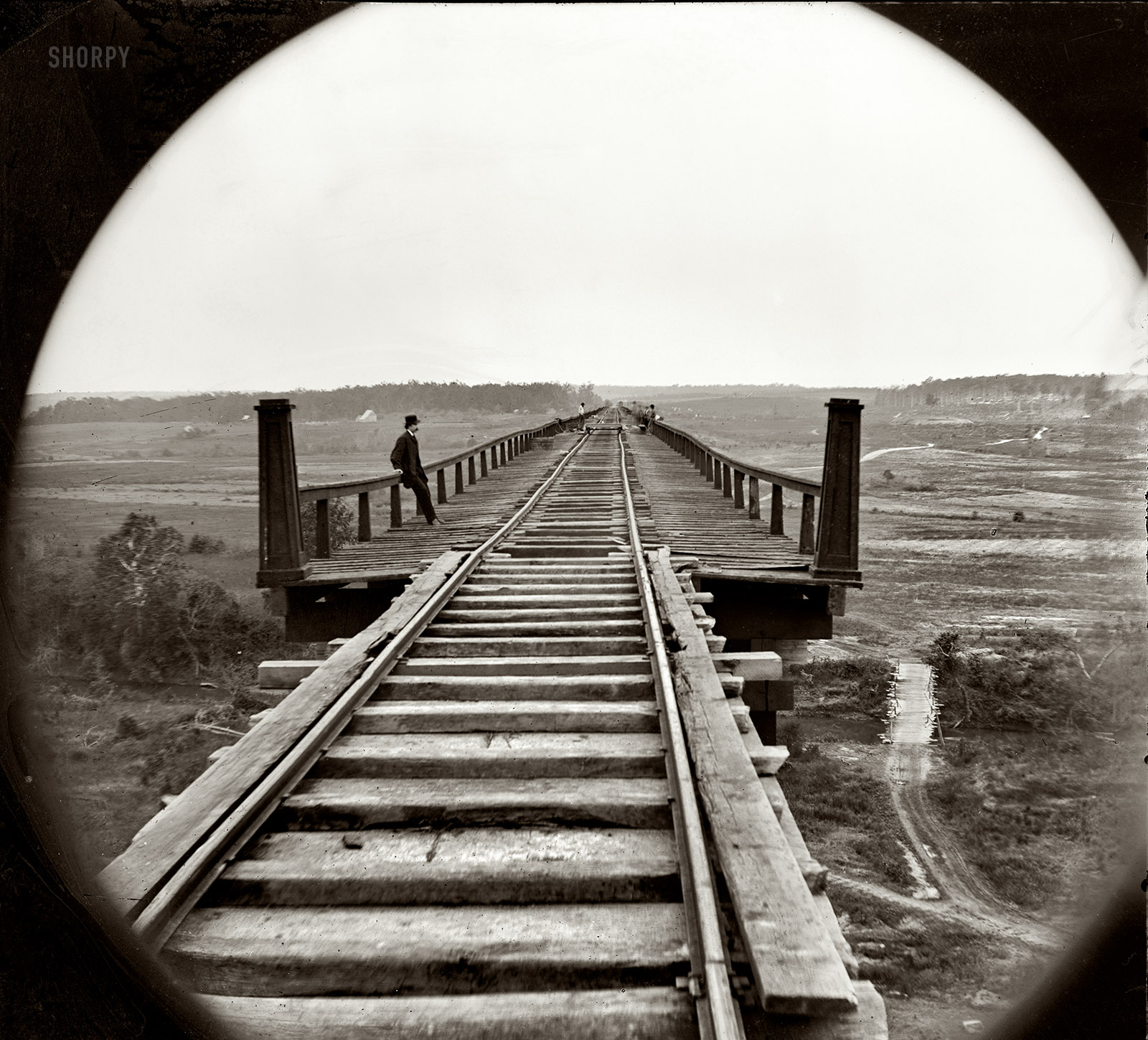 April 1865. "Farmville, Virginia, vicinity. High bridge of the South Side Railroad across the Appomattox." From photographs of the main Eastern theater of war, the siege of Petersburg, June 1864-April 1865. Wet collodion glass plate negative, left half of stereograph pair, by Timothy H. O'Sullivan; from Civil War photographs compiled by Hirst Milhollen and Donald Mugridge. View full size.
