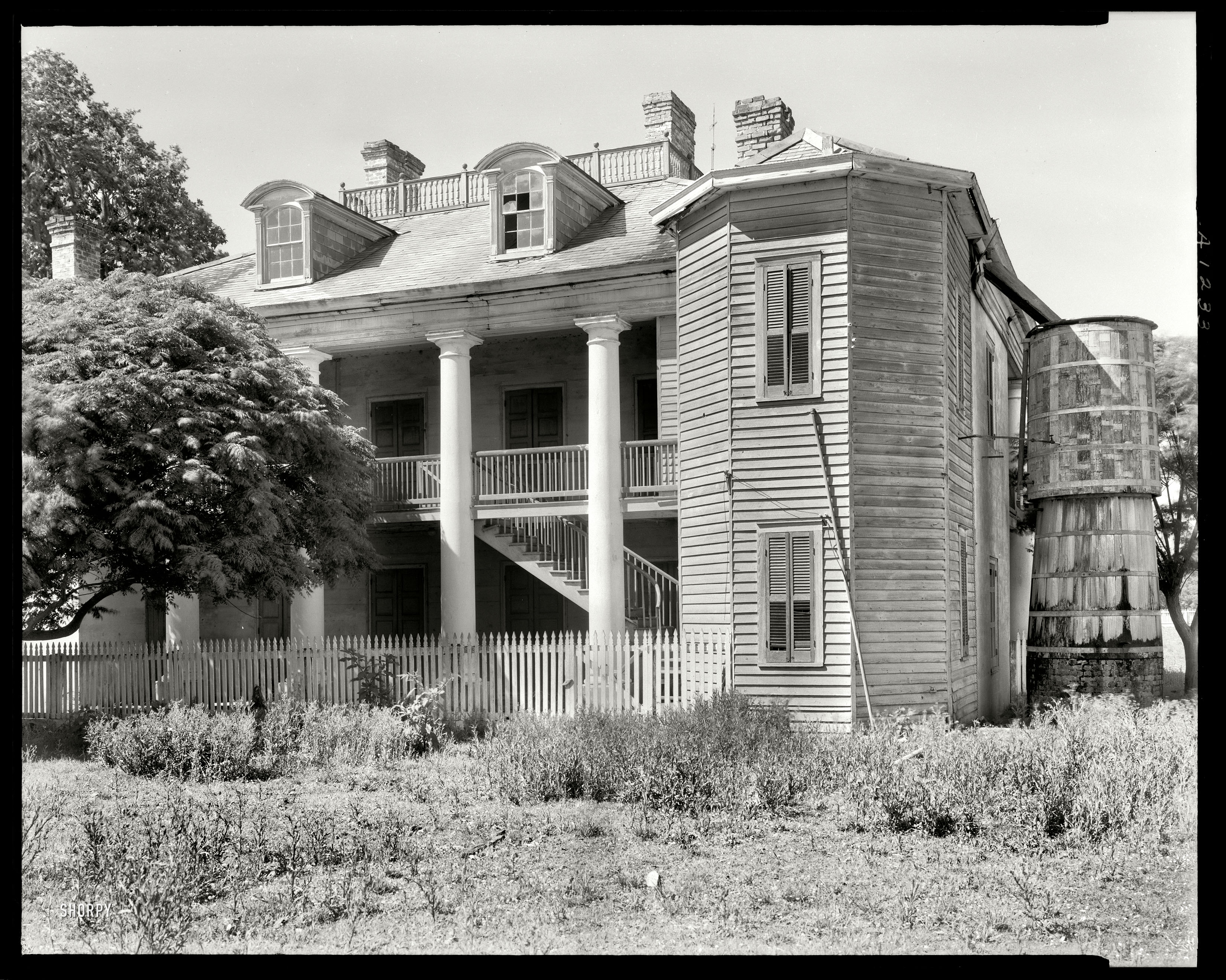 St. John the Baptist Parish, Louisiana, 1938. "Evergreen -- Wallace vicinity. Structure dates from 1835. Abandoned. Canal Bank Liquidators." 8x10 inch acetate negative by Frances Benjamin Johnston. View full size.