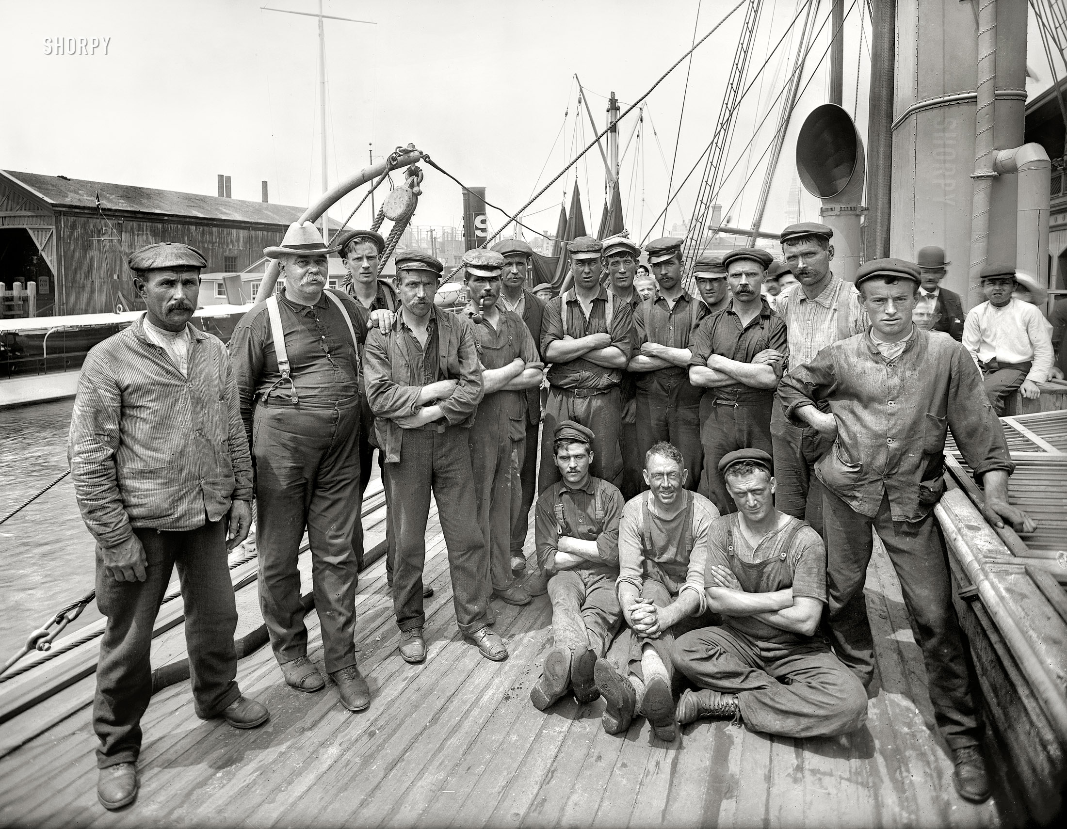 New York, September 4, 1909. "Crew of Peary arctic ship Roosevelt: First Mate Thomas Gushue (far left), Chief Engineer George A. Wardwell and the men." The Roosevelt sailed in the Hudson-Fulton celebration shortly after this portrait was made. 8x10 glass negative, Bain News Service. View full size.