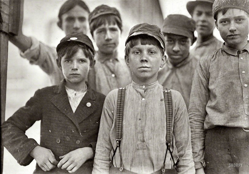 January 1909. "Doffers in Willingham Cotton Mill, Macon, Georgia. The three boys in front row have been in mill work for 4, 5 and 6 years respectively." Photo by Lewis Hine for the National Child Labor Committee. View full size.
