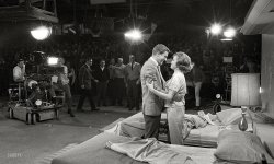 1963. Dick Van Dyke and Mary Tyler Moore on the set of The Dick Van Dyke Show with Jerry Paris directing in front of the studio audience that served as their unbilled co-star. Photo by Earl Theisen for Look magazine. View full size.