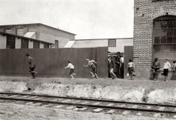 April 1911. Meridian, Mississippi. "Noon hour at Priscilla Knitting Mills. Small boys who work here." Photograph by Lewis Wickes Hine. View full size.
