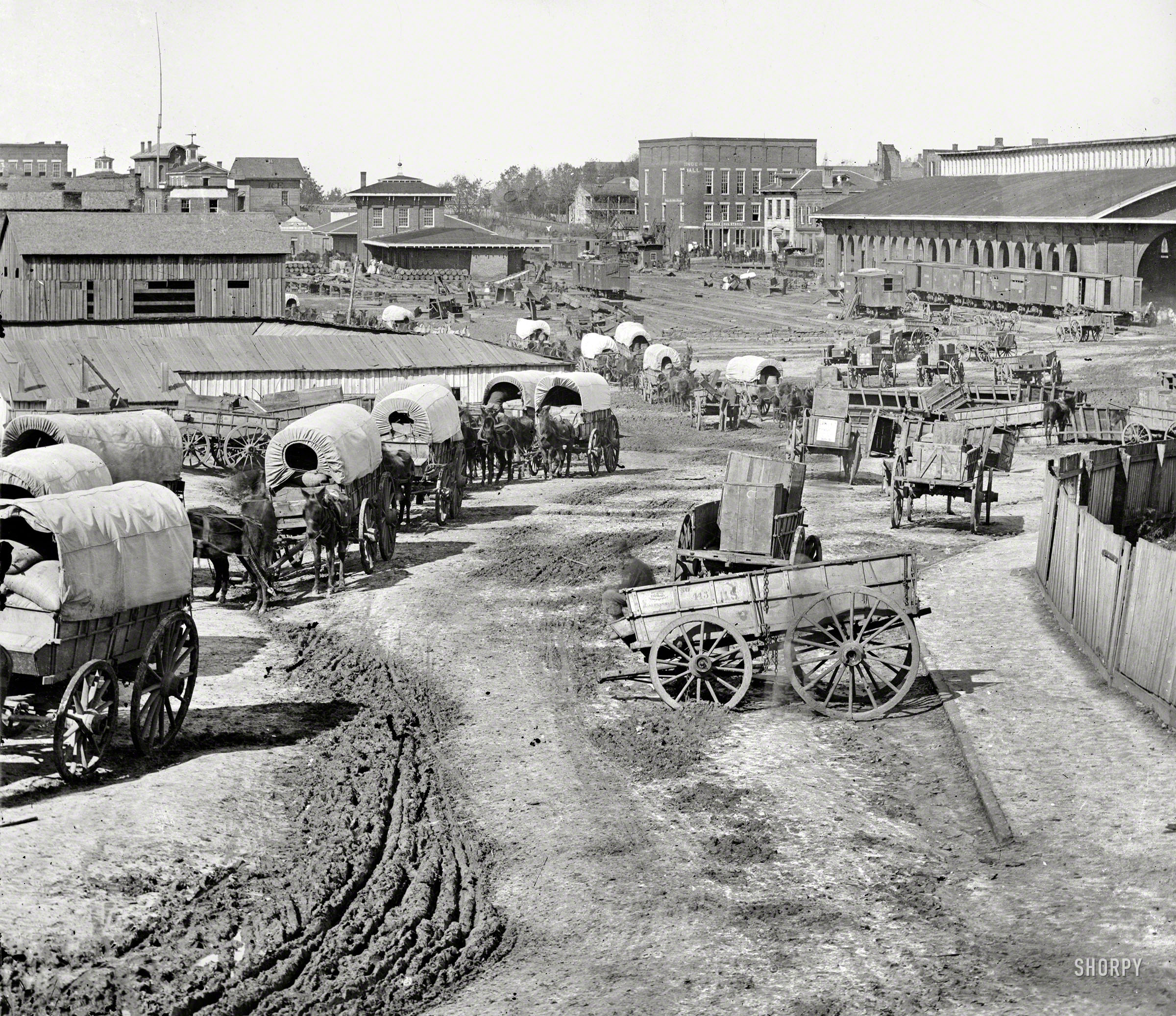 Atlanta, 1864. "Federal Army wagons at railroad depot." And maybe Scarlett O'Hara in the distance. Wet plate negative by George N. Barnard. View full size.