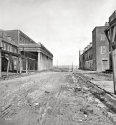 "1865. Charleston, South Carolina. Vendue Range looking east from near the corner of East Bay Street." Aftermath of the Great Fire of 1861 and bombardment by the Federal Navy. Wet plate glass negative. View full size.