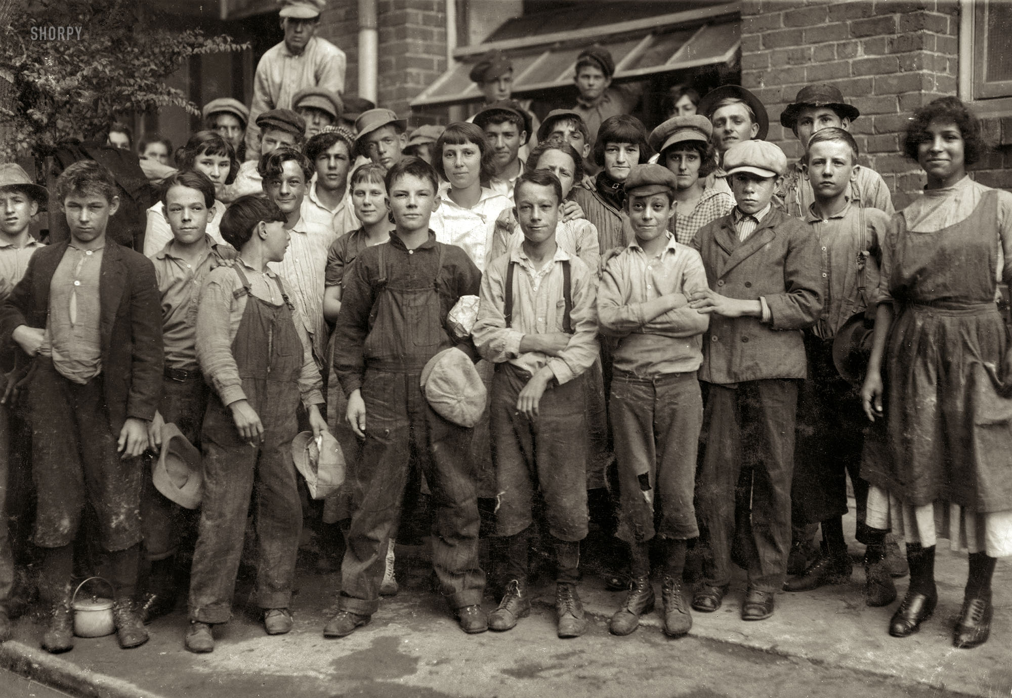 November 1913. New Orleans, Louisiana. "Group of workers in Lane Cotton Mill showing the youngest workers and typical of conditions in New Orleans. Violations of the law are rare." Photo by Lewis Wickes Hine. View full size.