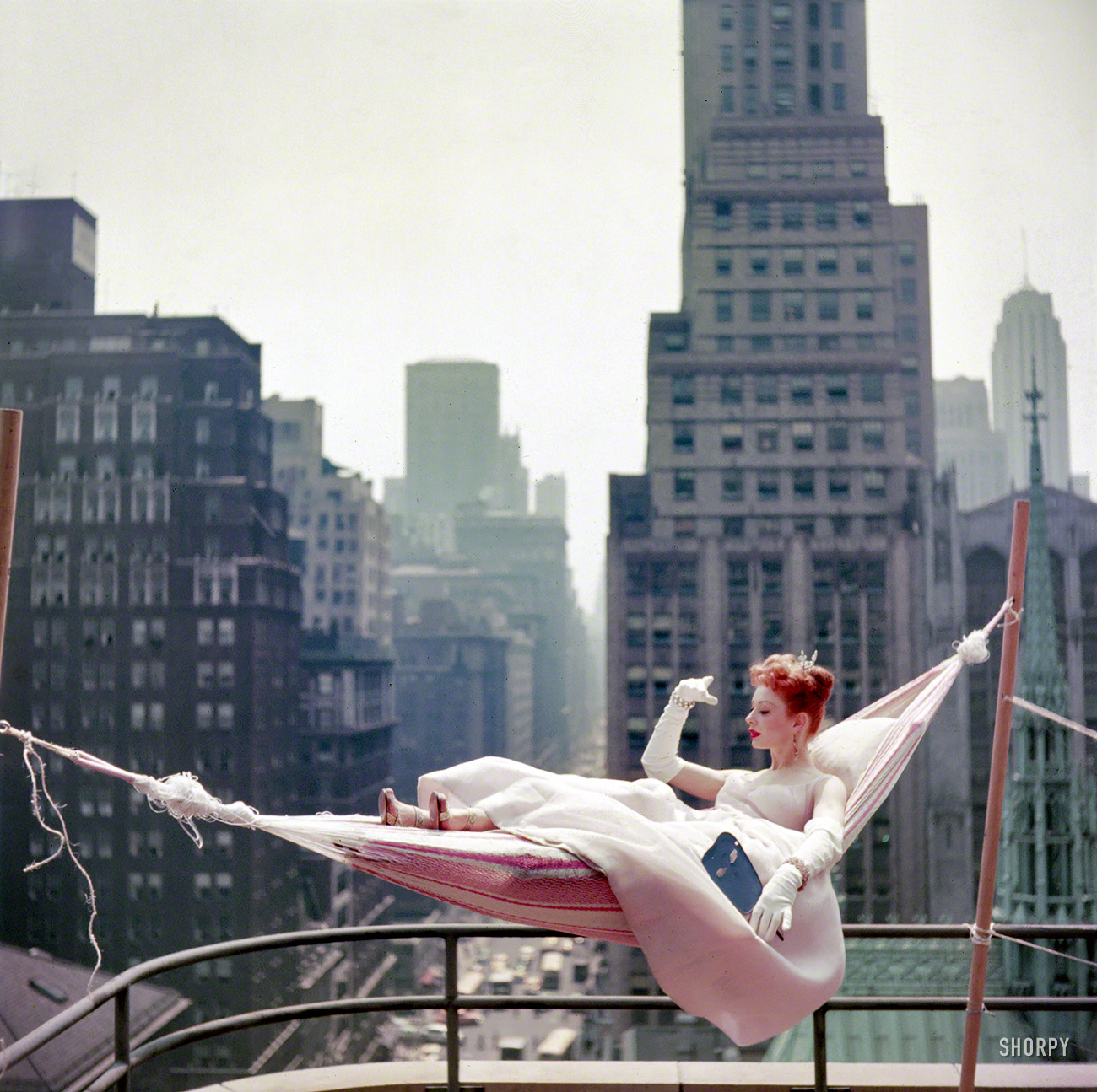 May 1953. "Dancer-actress Gwen Verdon in a hammock wearing a ballgown." Color transparency from photos taken for the Look magazine assignment "Midsummer Fantasies: How to Keep Cool in a Heat Wave." View full size.