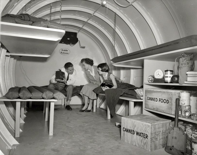 1955. "H-bomb hideaway. Family seated in a Kidde Kokoon, an underground fallout shelter manufactured by Walter Kidde Nuclear Laboratories of Garden City, Long Island." United Press photo. View full size.
