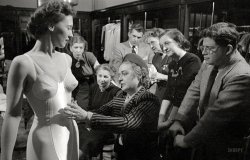 1949. "Sue Hughes, a traveling lingerie sales representative for the Formfit Company of Chicago, with store model checking fit." From photos by Stanley Kubrick and Phillip Harrington for the Look magazine assignment "Traveling Saleswoman U.S.A." View full size.