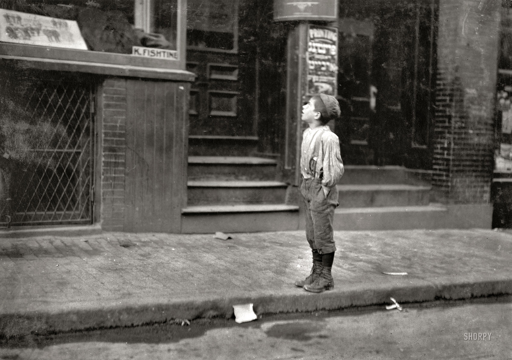 October 1909. Boston, Massachusetts. "Fire - Fire - I want to make the fire. An Italian boy on Salem Street Saturday morning, offering to make fires for Jewish People." Photograph and caption by Lewis Wickes Hine. View full size.