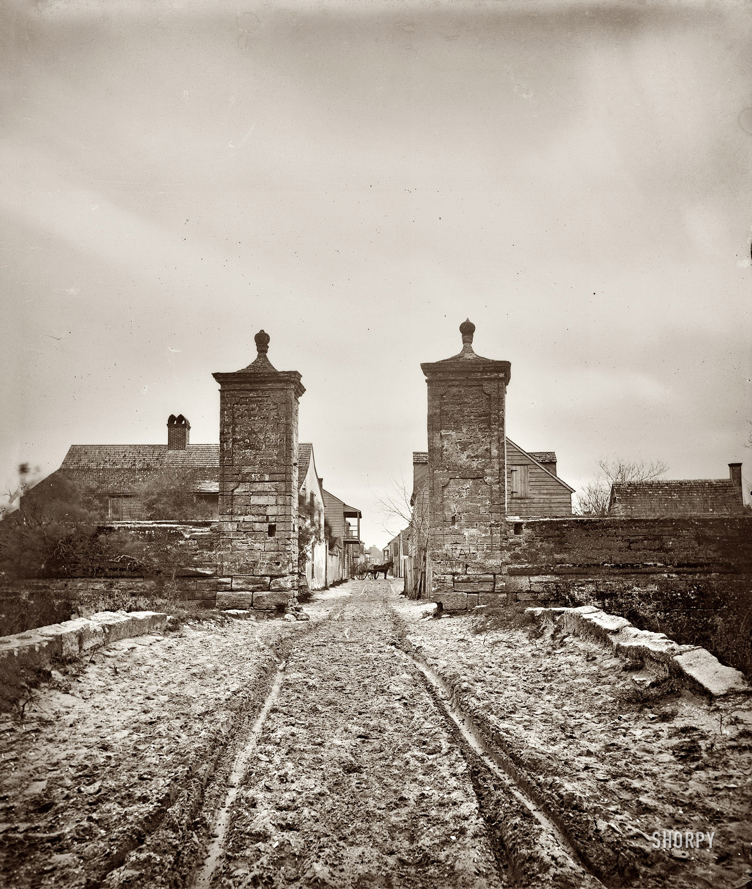 St. Augustine, Florida, sometime around 1865, seen looking through the city gates (shown earlier from the other direction). Half of a wet-collodion glass-plate stereograph made by Samuel A. Cooley. View full size.