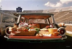 Fall 1960. A Kodachrome by our old friend Arthur Rothstein, taken for the Look magazine assignment "Tailgate Gourmets." "Food for tailgate picnics displayed in the backs of station wagons, including a Ford Country Squire, a Dodge Lancer, and a Pontiac Bonneville Safari parked in a football stadium. Also images of a couple wearing raccoon coats standing next to their Dodge Lancer." View full size.