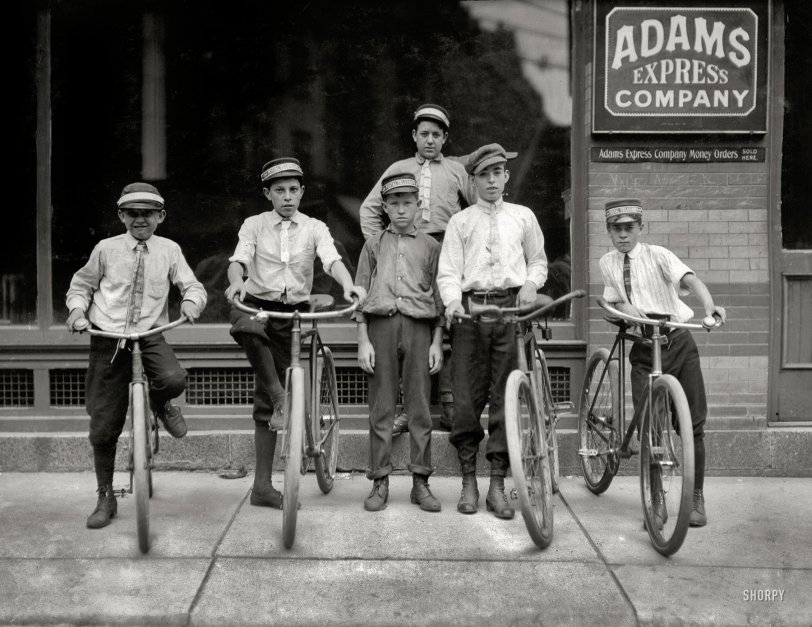 June 1911. Norfolk, Virginia. "A typical group of Postal Messengers. Smallest on left end, Wilmore Johnson, been there one year. Works days only. The Postal boys are not nearly so young in Norfolk and also in other Virginia cities as are the Western Union boys." Photograph by Lewis Wickes Hine. View full size.
