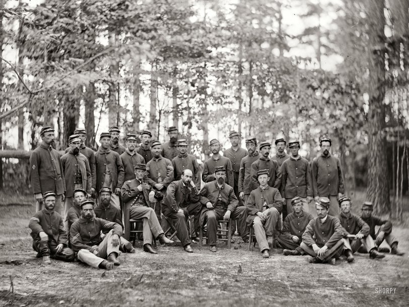 August 1864. Petersburg, Virginia. "Commissioned and non-commissioned officers of Cos. C and D, 1st Massachusetts Cavalry." Happy Veterans Day from Shorpy. Wet plate glass negative; photographs from the main Eastern theater of the war, the siege of Petersburg, June 1864-April 1865. View full size.
