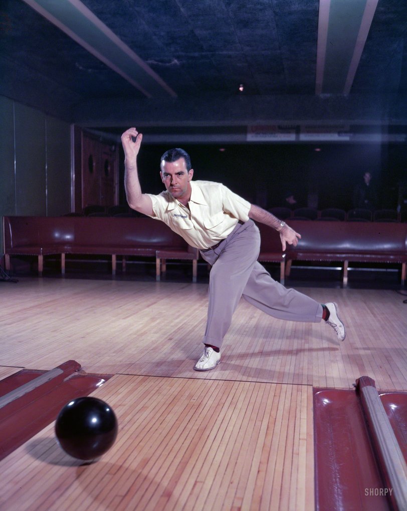 &nbsp; &nbsp; &nbsp; A high school basketball star despite the fact that his left hand had been badly mangled in a childhood accident, Bomar decided to concentrate on bowling after graduation. &nbsp; &nbsp; --Ralph Hickok
1951. "Professional bowler Buddy Bomar demonstrating technique." Photo by Bob Lerner for the Look magazine article "Improve Your Bowling." View full size.
