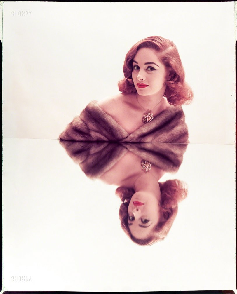 July 1952. "Photographs show models posed leaning shoulders against mirrors, resulting in reflected images. Includes women wearing furs and jewels; various hairstyles." Color transparency by Louis Faurer for the Look magazine assignment "Reflected Beauty: Hair Now Gets Double Exposure." View full size.

