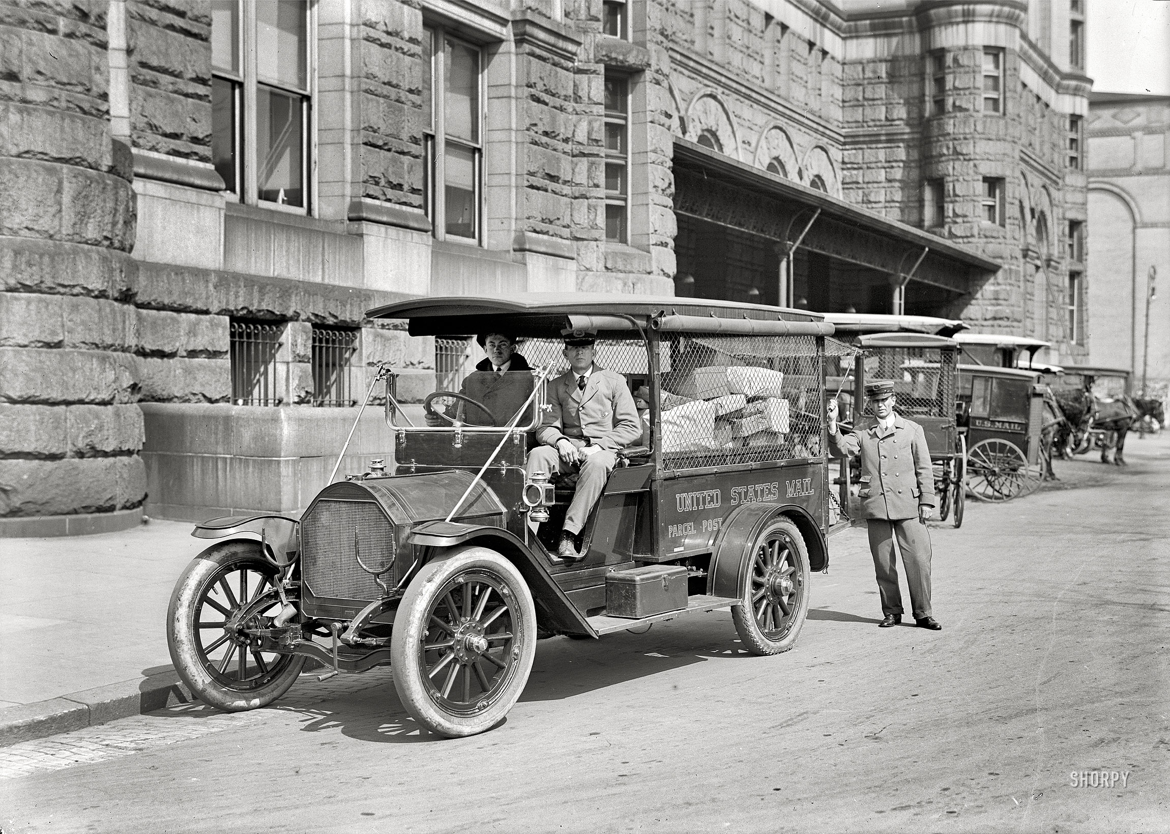 Washington, D.C., 1914. "Post Office Department -- parcel post." A scene outside the post office on Pennsylvania Avenue in its final year of operations before it moved and the building became known as the Old Post Office. View full size.