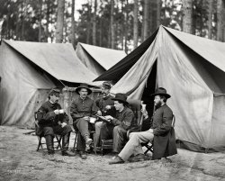 October 1864. "Petersburg, Virginia. Hospital stewards of 2d Division, 9th Corps, in front of tents." Wet plate glass negative by Timothy O'Sullivan. View full size.