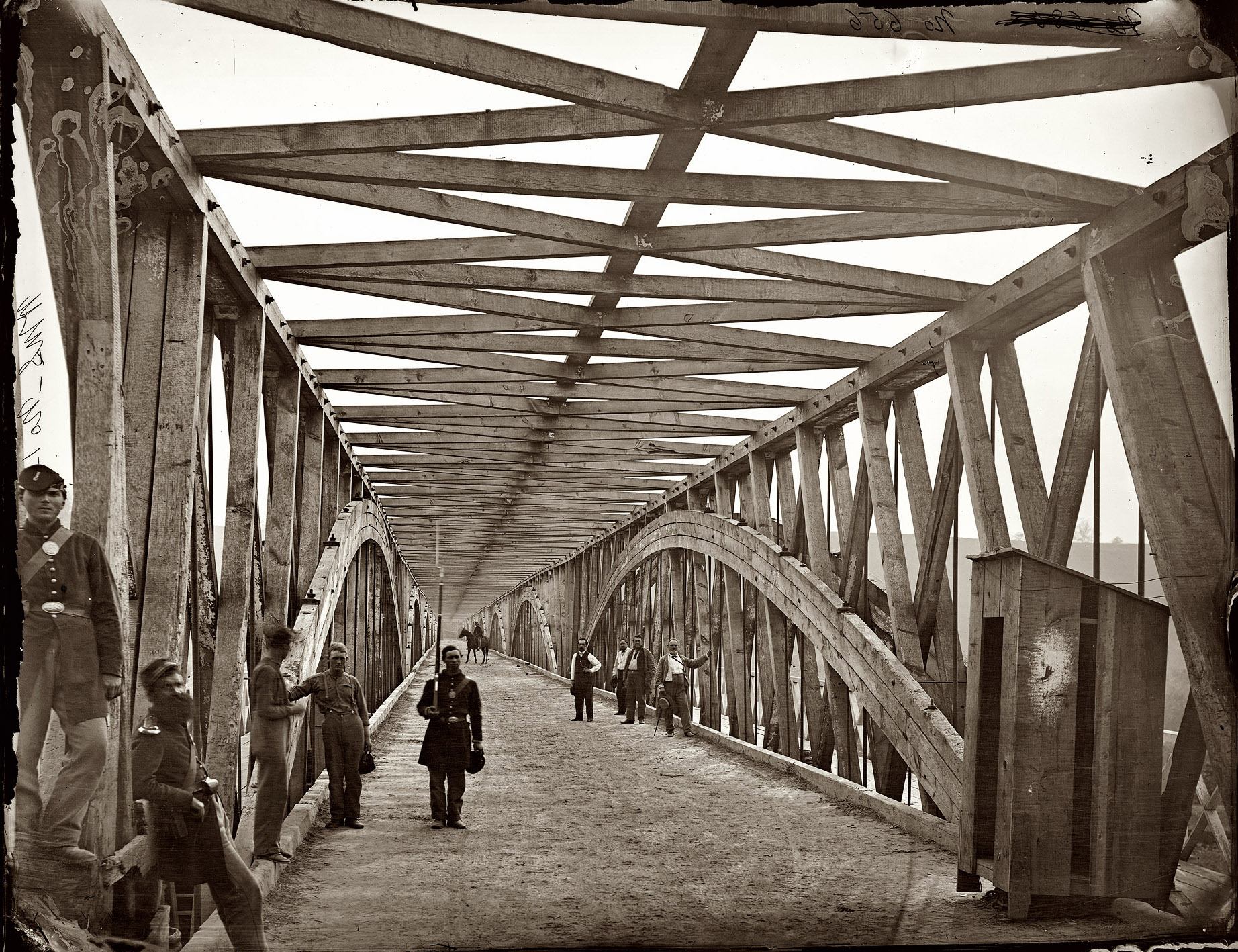 View down the Chain Bridge over the Potomac near Washington circa 1865. Wet collodion glass plate negative by William Morris Smith. View full size.